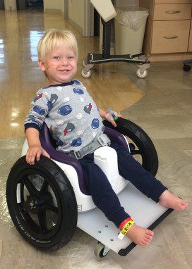 Kid on his wheel chair